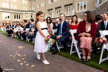 Load image into Gallery viewer, Flower girl in Adelina dress walking down the aisle throwing petals