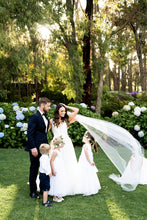 Load image into Gallery viewer, Bride and groom with page boy and flower girls in Grace flower girl dresses Ana Balahan
