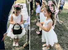 Load image into Gallery viewer, Adelina dress Ana Balahan Girl in ivory color dress with flower wreath and petal basket

