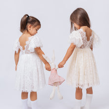 Load image into Gallery viewer, Ana Balahan Camila Light Ivory and Champagne Color Dresses Two Little Girls in open back dress playing with bunny