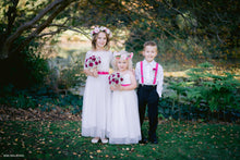 Load image into Gallery viewer, Two junior bridesmaids in their long dresses with lace tops and floral summer rose wreaths and page boy wearing matching accessories.