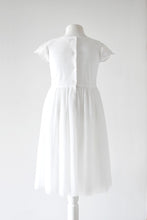 Load image into Gallery viewer, Lydia Light ivory dress with cap sleeves and pleated skirt back view Ana Balahan