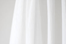 Load image into Gallery viewer, Lydia Light ivory dress with cap sleeves and pleated skirt skirt close view Ana Balahan