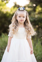 Load image into Gallery viewer, Girl in Sofia champagne lace flower girl dress with floral headpiece
