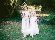 Load image into Gallery viewer, Two little girls in their long romantic wedding outfits with charming lace tops and with flower wreaths by Ana Balahan Australia