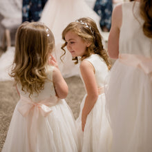 Load image into Gallery viewer, Two pretty girls in Adelina ivory color dresses and blush color sash Ana Balahan