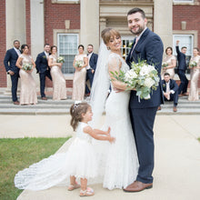 Load image into Gallery viewer, Bride and groom together with a flower girl dress in Adelina ivory dress