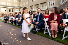 Load image into Gallery viewer, Flower girl in Adelina dress walking down the aisle throwing petals
