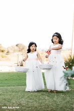 Load image into Gallery viewer, Two flower girls walking down the aisle throwing petals

