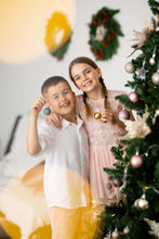 Load image into Gallery viewer, Ana Balahan Boy in white cotton linen shirt and shorts and girls decorate the Christmas tree Adelaide
