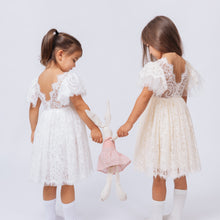 Load image into Gallery viewer, Ana Balahan Camila Light Ivory and Champagne Color Dresses Two Little Girls in open back dress playing with bunny
