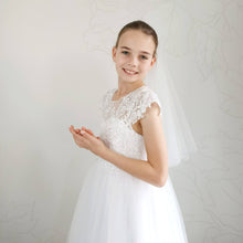 Load image into Gallery viewer, Ana Balahan Girl wears first communion dress and White Plain Veil Medium length Adelaide
