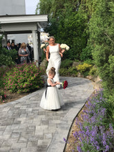 Load image into Gallery viewer, Bride and little flower girl with their flowers
