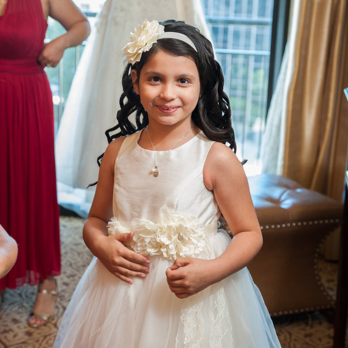 Bridesmaids and Flower girl wearing Camellia set of wedding accessories floral sash and headpiece