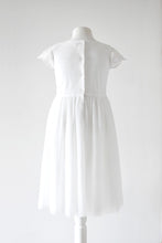 Load image into Gallery viewer, Lydia Light ivory dress with cap sleeves and pleated skirt back view Ana Balahan
