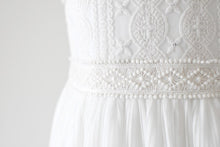 Load image into Gallery viewer, Lydia Light ivory dress with cap sleeves and pleated skirt front view waistline close view Ana Balahan
