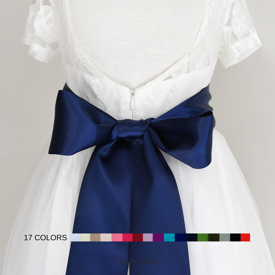 Off white color flower girl dress with the 8 cm navy color satin sash back view