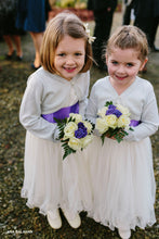 Load image into Gallery viewer, Two cute flower girls with flowers in Adelina dress with purple color sash
