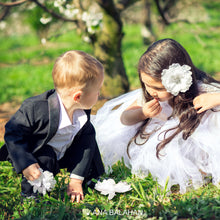 Load image into Gallery viewer, Boy in stylish gentlemen suit picking flowers with a flower girl
