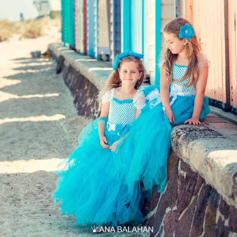 Two girls in Breeze dress near beach houses