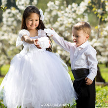 Load image into Gallery viewer, Girl in white tutu dress and boy watching a flower 
