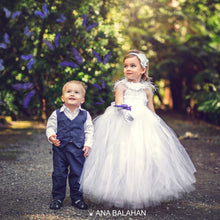 Load image into Gallery viewer, Boy in a fashionable suit and a flower girl looking at butterflies
