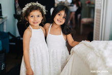 Load image into Gallery viewer, Two pretty girls in Florence dress and floral wreath prepare to be flower girls at a wedding
