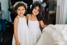 Load image into Gallery viewer, Two pretty girls in Florence dress and floral wreath prepare to be flower girls at a wedding
